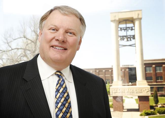 Chancellor Doug Kristensen in Front of the Bell Tower